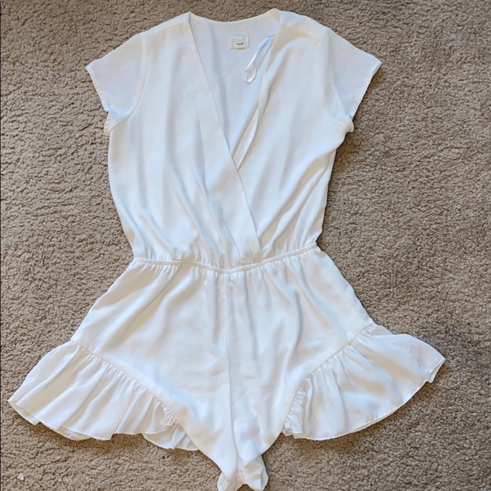 White ruffle low v romper